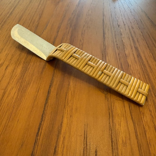 You are viewing an original Aluminum + Caned Handle Cheese Knife/Server by Russel Wright for Raymor c1939. This unique...