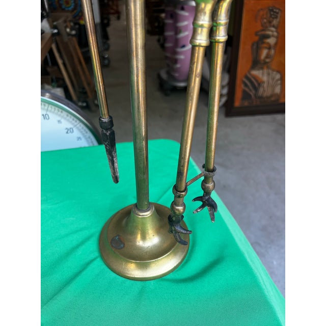 Up for consideration is a beautiful vintage brass fireplace tools and holder. This would look lovely in your home, and it...