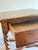 Substantial vintage side table with beautifully turned barley twist legs, scrolling stretcher base, and rich walnut toned...