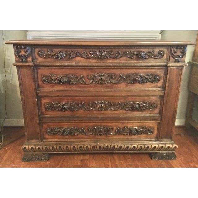 Large Antique chest of drawer has four generous sized drawers in great working condition. Heavily carved scroll detail...