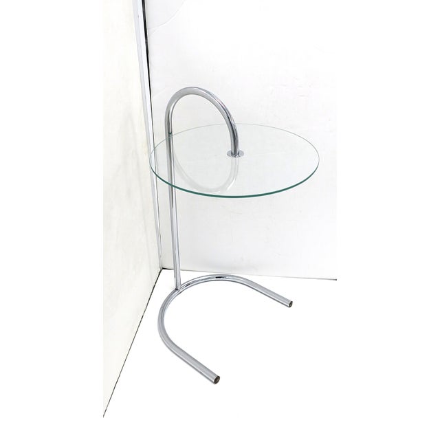 A tubular chrome and glass side drinks table, Postmodern design period, by/attributed to Swedish designer Tord Björklund,...