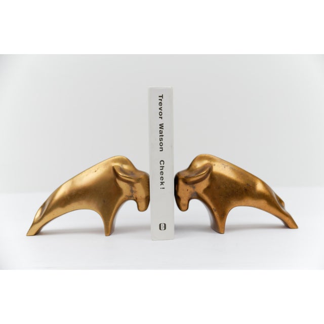 2x Mid-Century Modern massive brass bull bookends, 1960s
