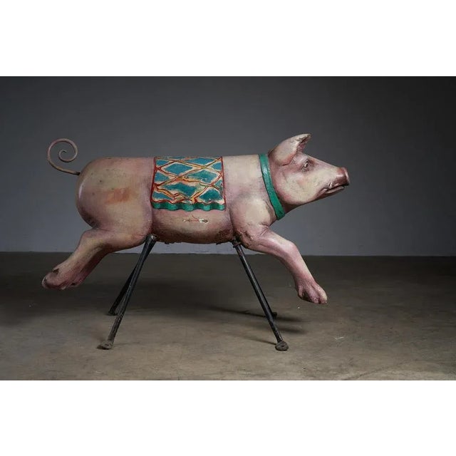 Add a touch of whimsy to your space with this charming antique carousel figure featuring a carved wooden pig. Crafted with...
