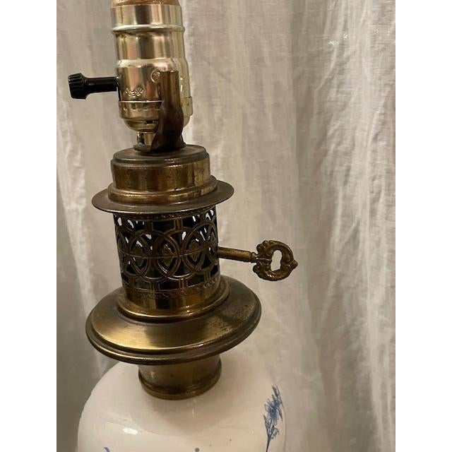 Chinoiserie Vintage White and Blue Floral Porcelain Lamp With Brass Accents For Sale - Image 3 of 3