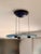 The "Aurora" pendant light for Arteluce, a division of Flos, was designed in 1980 by Perry King and Santiago Miranda. The...