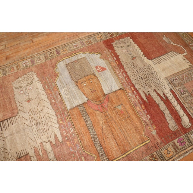 Wonderful Turkish Anatolian accent intermediate size rug depicting a pair of large lions in between an infamous Turkish...