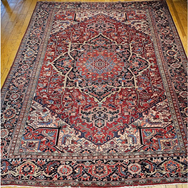 "This vintage Heriz Serapi rug from Northwest Persia showcases a color palette and design sophistication closely aligned...