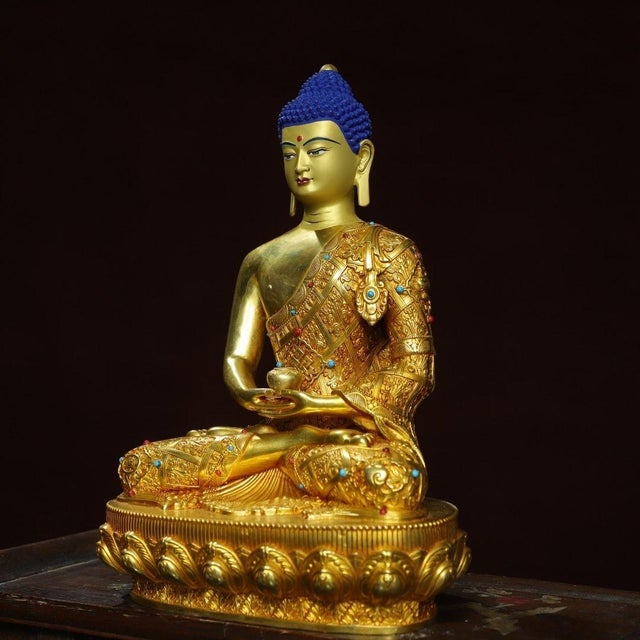 This is a finely crafted antique gilt bronze sculpture of Shakyamuni Buddha, the founder of Buddhism. The Buddha is...