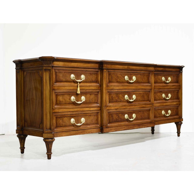 A finely crafted French Regency / Louis XVI style nine-drawer dresser by Karges, executed in richly figured burled walnut...
