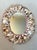 Beautiful vintage handmade shell encrusted oval wall mirror. This piece was crafted by hand with each shell applied...