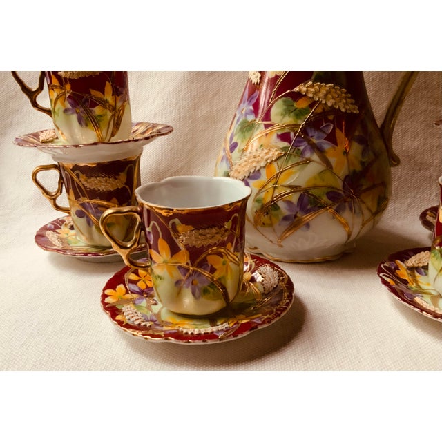 An exceptional 13-piece antique porcelain hot chocolate serving set crafted in Japan during the late 19th-century Meiji...