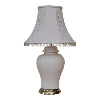 Vintage American Ivory Glazed Ceramic Table Lamp With Brass Base and Embossed Bell Shade For Sale