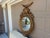 A beautiful large Federal-style convex mirror, crowned by a finely modeled spread-wing eagle above an elaborate...