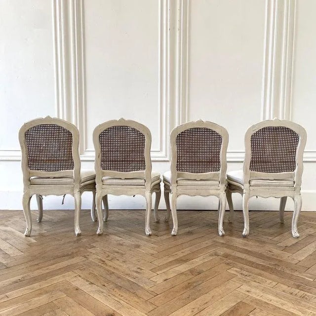 Antique French Painted Cane Back Dining Chairs With Linen Upholstery