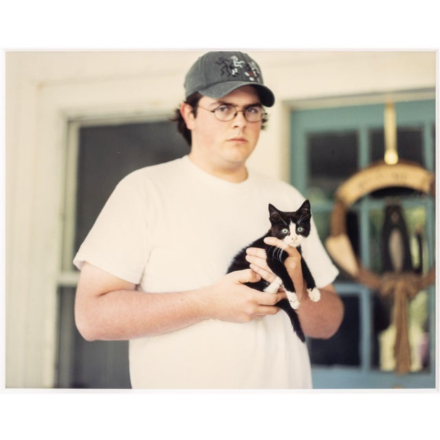 Tracey Baran (American, 1975-2008), Untitled (Man Holding a Black and White Kitten), Chromogenic Print in Colors, 1998,...