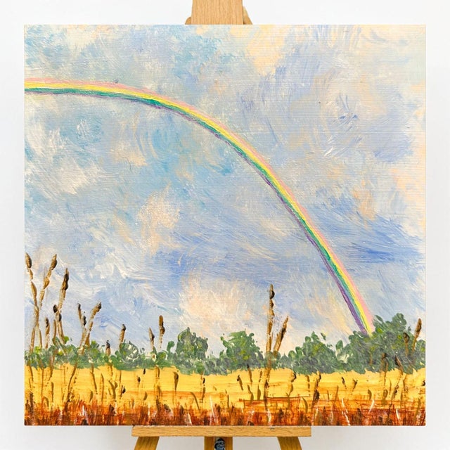 This professionally hand-painted acrylic artwork showcases a serene rural landscape with a vibrant rainbow in a cloudy sky...