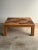 This vintage monumental rattan coffee table features a dramatic concentric sunburst top framed within a clean square...