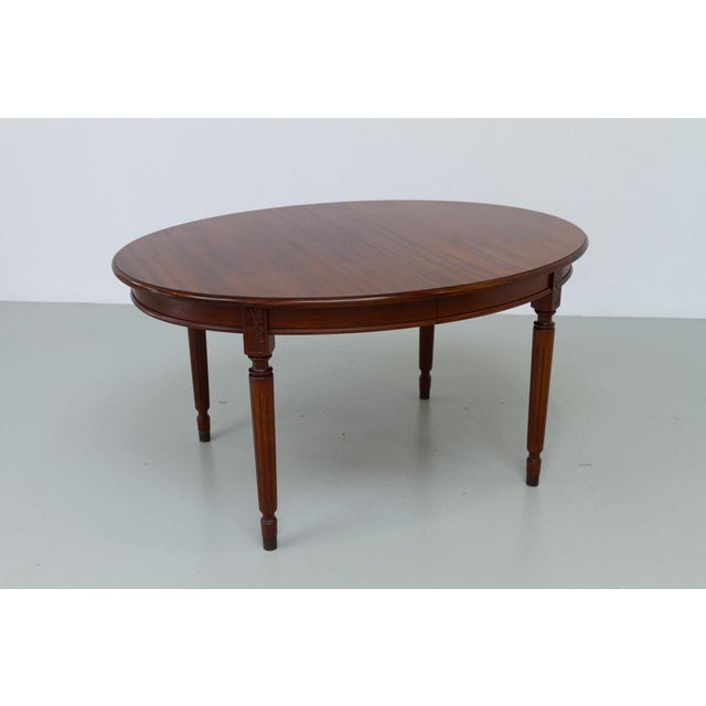 Danish Hepplewhite Oval Mahogany Dining Table by Farre Møbelfabrik, 1970s. Elegant oval dining room table with one...