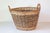 Step into the world of English craftsmanship with this exquisite 20th-century wicker basket, sourced from a private estate...