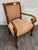 This is a vintage Hancock & Moore Jockey Club armchair featuring a sculptural hardwood frame, dramatic continuous scroll...