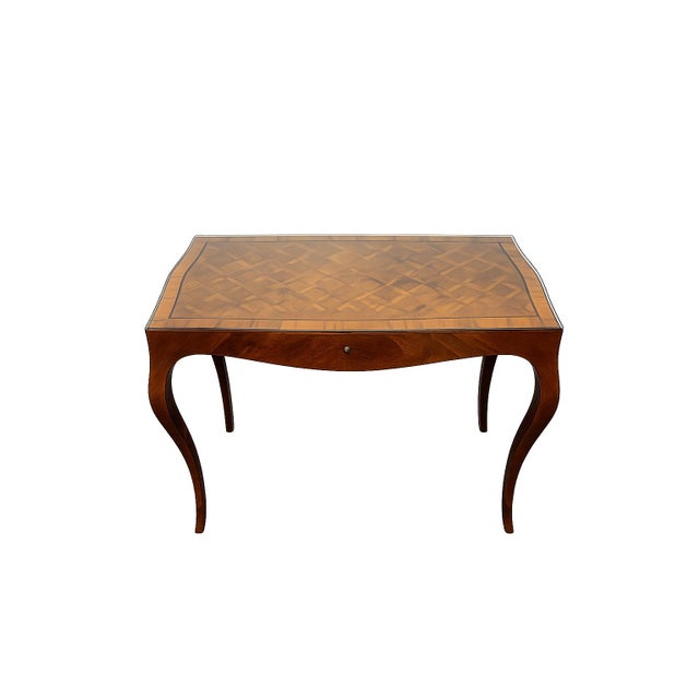 Beautiful Italian-made burl wood writing desk featuring an intricately figured parquetry top beneath a fitted glass...