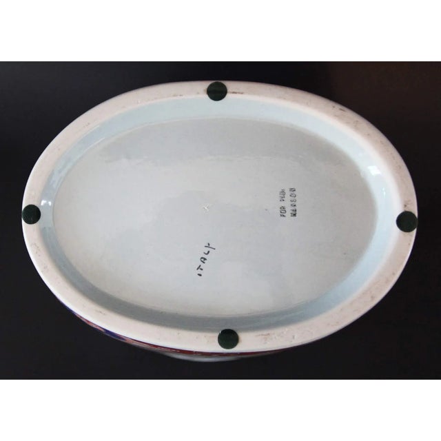 Decorative vintage cache pot designed in the Japanese Imari style, characterized by its underglaze blue, iron red, and...