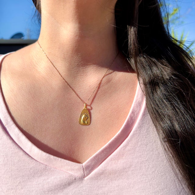 About This Pendant: This exquisite 18K vintage pendant features a luminous bloomed gold finish with intricate detailing....