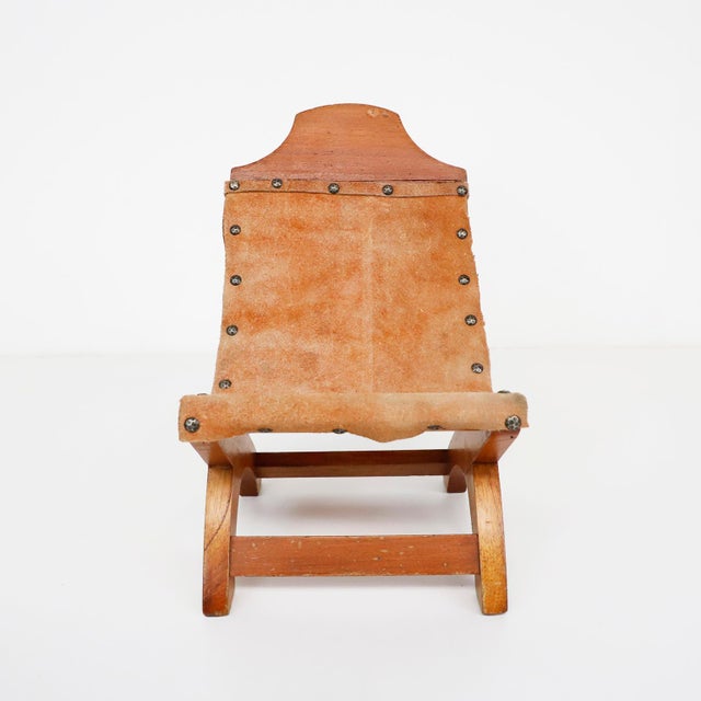 We offer this Petite Mexican Butaquein the style of Clara Porset, circa 1950.