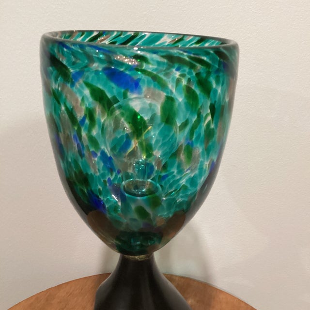 This Unique Table Lamp features a mottled art class shade with a sculpted base, adding a touch of vintage charm to any...