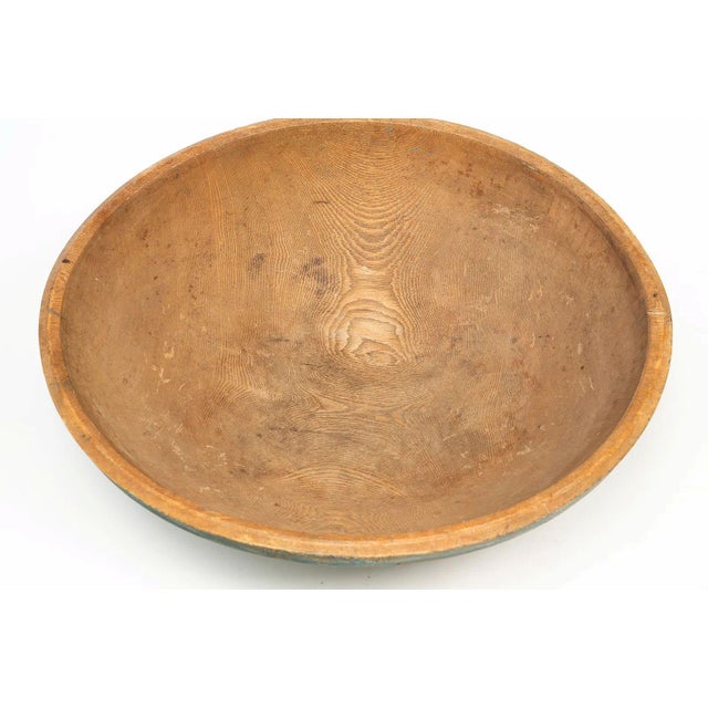 A striking example of early American utilitarian craftsmanship, this large hand turned ash bowl dates to the 19th century...