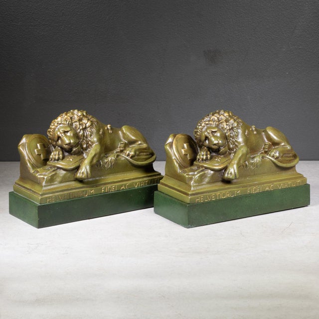 ABOUT Solid bronze Lion of Lucerne bookends featuring an engraved Latin inscription "Helvetiorum Fidei AC Virtuti". The...