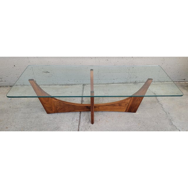 Adrian Pearsall for Craft Associates sculptural coffee table with glass top. Base made of solid walnut with arcing lines....