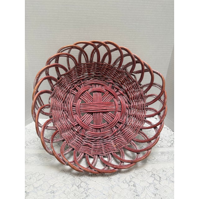 Unusual vintage large rustic wood loopy woven basket. Washed and faded in a rustic rosy pink tone with age and wear which...