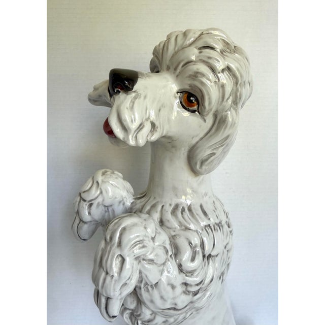 This delightful vintage Italian ceramic poodle sculpture features a playful expression, curly textured fur detailing, and...