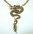 Enter the dragon! You will turn heads and garner compliments with this striking dragon necklace in an antiqued gold tone...