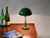 Unique Italian adjustable table lamp in chrome with a green enameled shade, inspired by the iconic design of the Bauhaus...