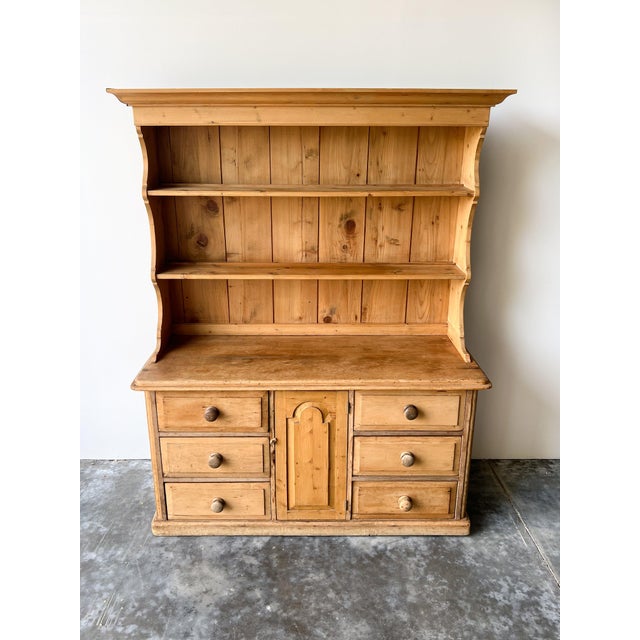 A lovely antique English pine kitchen dresser from the mid-late 19th century. Sturdy, solid and in wonderful shape. Six...