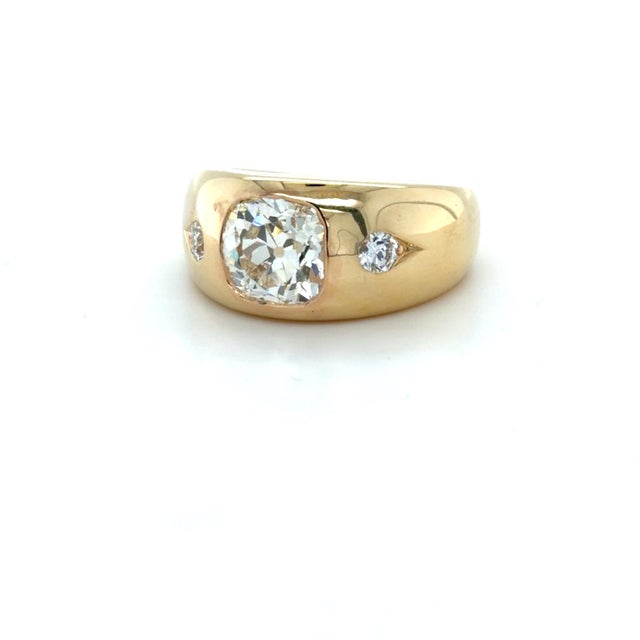 This gorgeous gypsy ring contains three burnish set old cut diamonds with the center old mine cut diamond weighing...
