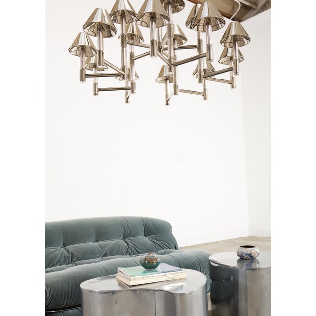 A sculptural and dramatic pair of Mid-Century Modern kidney-form biomorphic side or drinks tables in the style of Karl...