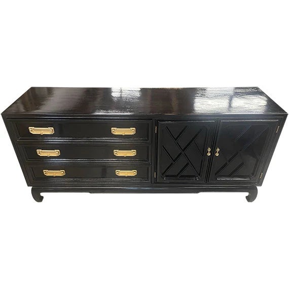 Vintage dresser featuring a rich black painted finish with warm brass hardware. Three drawers and a cabinet with three...