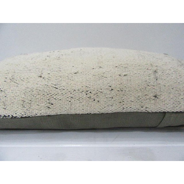 This is a pillow cover made from a vintage kilim rug. The piece was properly washed and ready to use. Pillow inserts not...