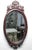 Late 19th Century Victorian Carved Mahogany Oval Beveled Wall Mirror An exceptionally fine example of Rococo Revival...