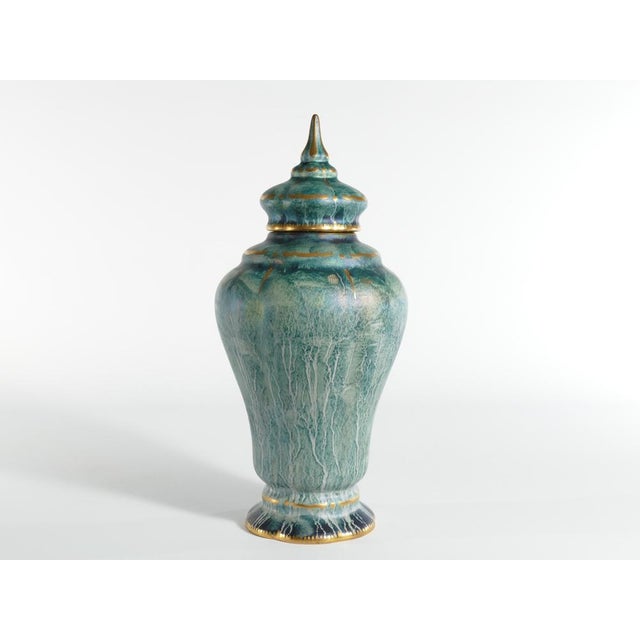This large and exquisite handmade lidded vase, is skillfully crafted by the renowned swedish ceramic artist josef ekberg....
