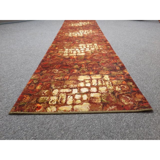 Colorful and very long flower power carpet from the 70s. The carpet is from the first owner and comes from a holiday home....