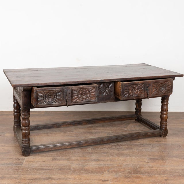 18th-century chestnut console table with deep, dark patina developed over 200 years of use. This 6'+ table features carved...