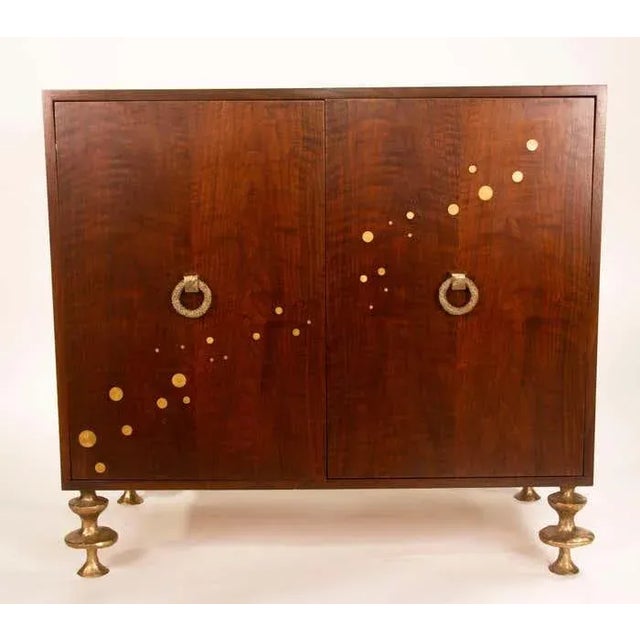 The handcrafted cabinet is inspired by the French arts décoratifs at the beginning of the last century. Adorned with brass...