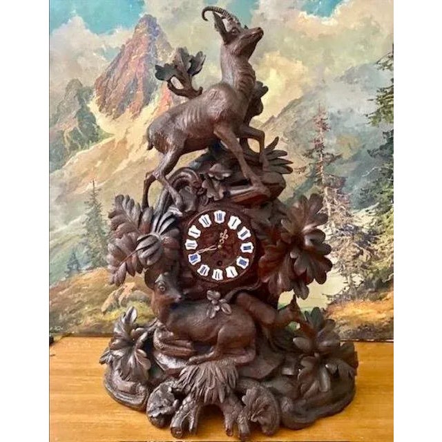 A late 19th century Swiss Black Forest hand-carved clock — the classic alpine carved case in the Brienz tradition, with...