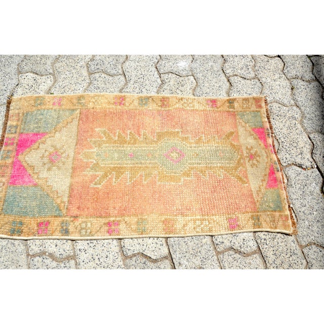 This is a vintage Turkish Oushak rug from the 1960s. The piece was hand-knotted.