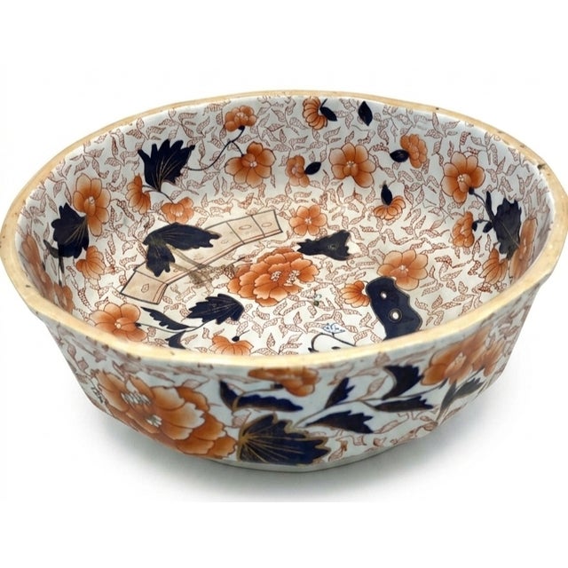 The image appears to show an antique or vintage Mason's Ironstone Imari-style chamber pot and matching basin featuring a...