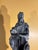 Italian grand tour style faux stone finish figure of Moses after Michelangelo. The figure is displayed on the vintage...